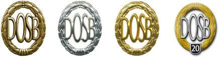 Vier Medaillen des Deutschen Olympischen Sportbundes (DOSB) in Gold, Silber und Bronze sowie eine Jubiläumsmedaille.